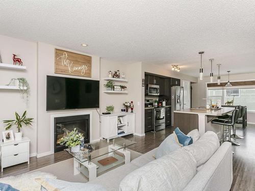 16023 10 Avenue, Edmonton, AB - Indoor Photo Showing Living Room With Fireplace