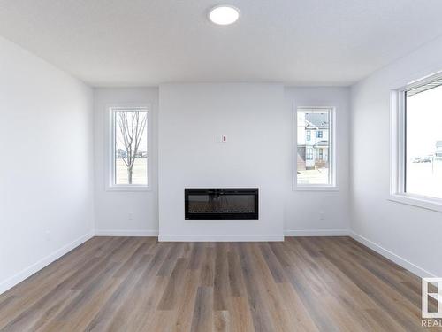 336 Genesis Villa(S), Stony Plain, AB - Indoor Photo Showing Living Room With Fireplace