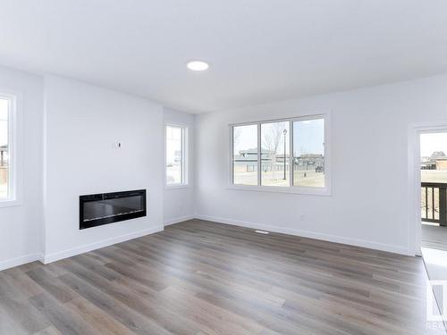 336 Genesis Villa(S), Stony Plain, AB - Indoor Photo Showing Living Room With Fireplace