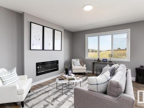 336 Genesis Villa(S), Stony Plain, AB - Indoor Photo Showing Living Room With Fireplace