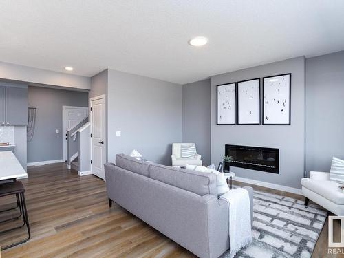 336 Genesis Villa(S), Stony Plain, AB - Indoor Photo Showing Living Room With Fireplace