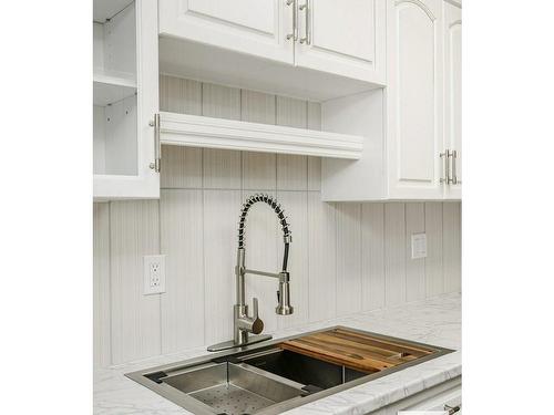 412 5520 Riverbend Road, Edmonton, AB - Indoor Photo Showing Kitchen With Double Sink