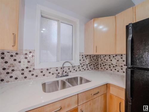 406 10707 102 Avenue, Edmonton, AB - Indoor Photo Showing Kitchen With Double Sink