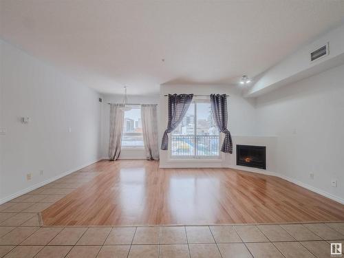 406 10707 102 Avenue, Edmonton, AB - Indoor Photo Showing Living Room With Fireplace