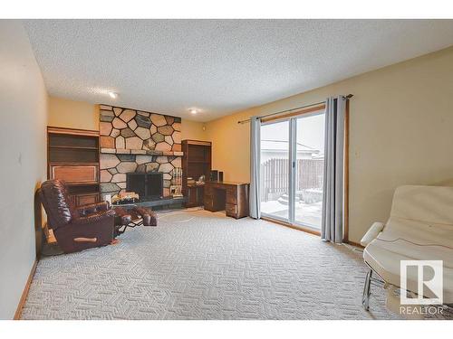 8416 150 Avenue, Edmonton, AB - Indoor Photo Showing Living Room With Fireplace