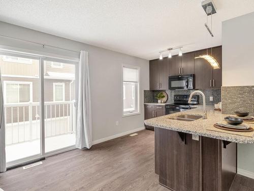 15 4050 Savaryn Drive, Edmonton, AB - Indoor Photo Showing Kitchen With Double Sink With Upgraded Kitchen