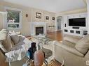 7314 Ada Boulevard, Edmonton, AB  - Indoor Photo Showing Living Room With Fireplace 