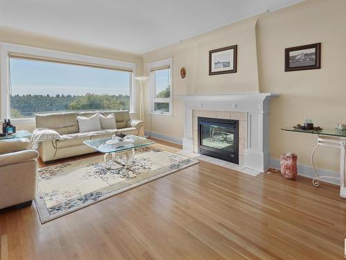 7314 Ada Boulevard, Edmonton, AB - Indoor Photo Showing Living Room With Fireplace