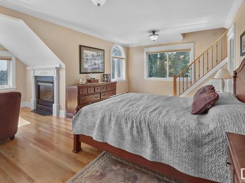 7314 Ada Boulevard, Edmonton, AB - Indoor Photo Showing Bedroom With Fireplace