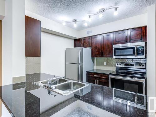 204 5816 Mullen Place, Edmonton, AB - Indoor Photo Showing Kitchen With Stainless Steel Kitchen With Double Sink