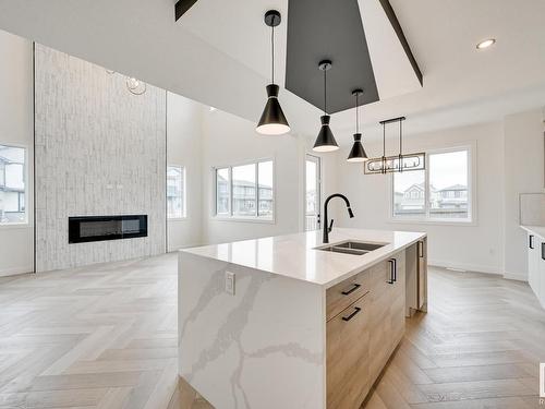 8 Prescott Boulevard, Spruce Grove, AB - Indoor Photo Showing Kitchen With Fireplace With Double Sink