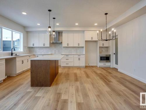 11 Resplendent Way, St. Albert, AB - Indoor Photo Showing Kitchen With Fireplace