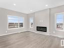 175 Catria Point(E) N, Sherwood Park, AB  - Indoor Photo Showing Living Room With Fireplace 