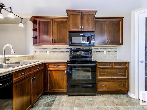 8106 97 Street, Morinville, AB - Indoor Photo Showing Kitchen With Double Sink