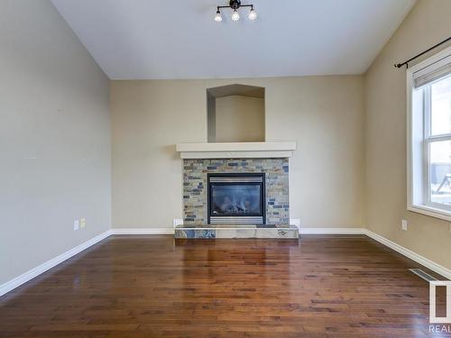 8106 97 Street, Morinville, AB - Indoor Photo Showing Living Room With Fireplace