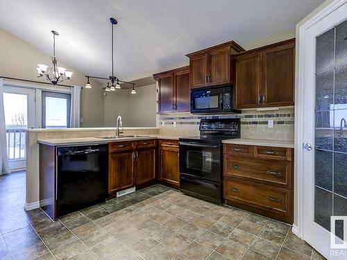 8106 97 Street, Morinville, AB - Indoor Photo Showing Kitchen With Double Sink