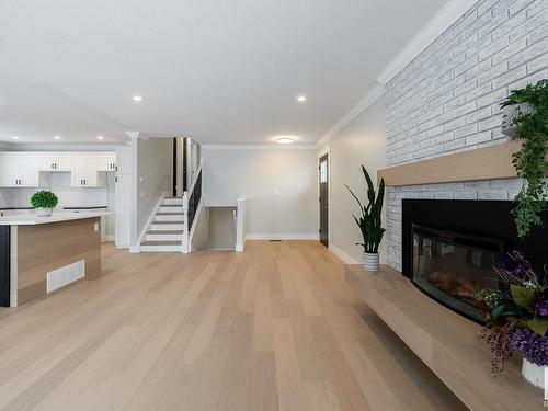 9211 99A Avenue, Morinville, AB - Indoor Photo Showing Living Room With Fireplace