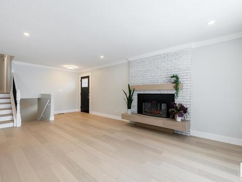 9211 99A Avenue, Morinville, AB - Indoor Photo Showing Living Room With Fireplace