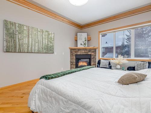 264 Kingswood Boulevard, St. Albert, AB - Indoor Photo Showing Bedroom With Fireplace