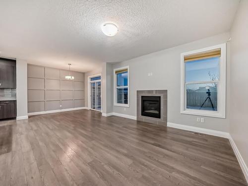 161 Harvest Ridge Drive, Spruce Grove, AB - Indoor Photo Showing Living Room With Fireplace