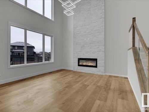 80 Deer Meadow, Fort Saskatchewan, AB - Indoor Photo Showing Other Room With Fireplace