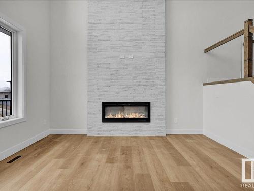 80 Deer Meadow, Fort Saskatchewan, AB - Indoor Photo Showing Living Room With Fireplace