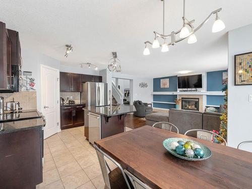 1409 37A Avenue, Edmonton, AB - Indoor Photo Showing Kitchen With Fireplace With Stainless Steel Kitchen With Upgraded Kitchen