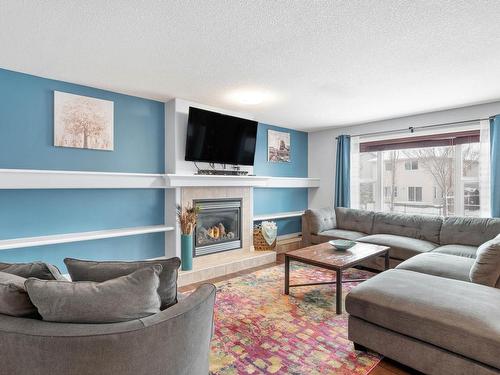 1409 37A Avenue, Edmonton, AB - Indoor Photo Showing Living Room With Fireplace