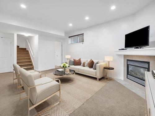 1409 37A Avenue, Edmonton, AB - Indoor Photo Showing Living Room With Fireplace