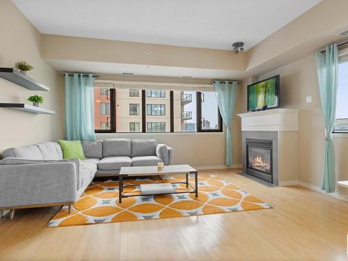 702 10319 111 Street, Edmonton, AB - Indoor Photo Showing Living Room With Fireplace