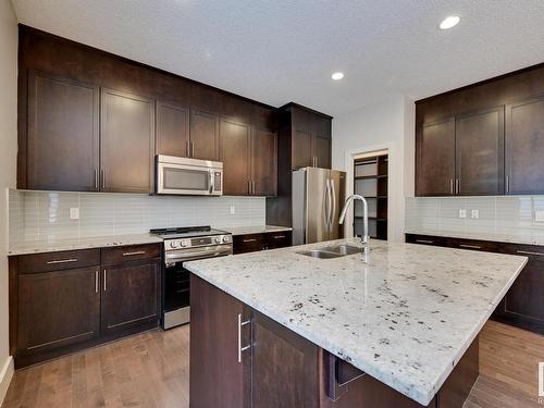 7506 May Common, Edmonton, AB - Indoor Photo Showing Kitchen With Double Sink With Upgraded Kitchen