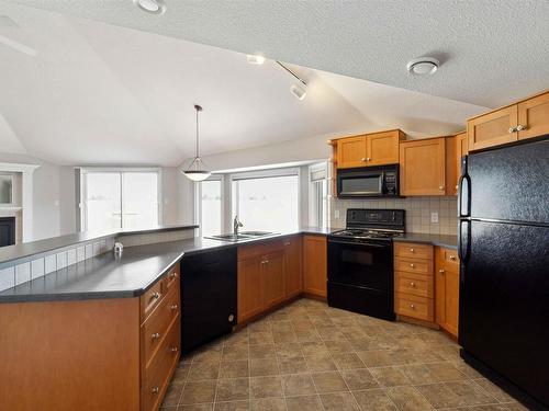 409 15499 Castle Downs Road, Edmonton, AB - Indoor Photo Showing Kitchen With Double Sink