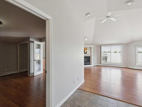 409 15499 Castle Downs Road, Edmonton, AB - Indoor Photo Showing Other Room With Fireplace