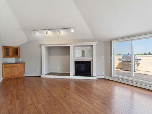 409 15499 Castle Downs Road, Edmonton, AB - Indoor Photo Showing Living Room With Fireplace