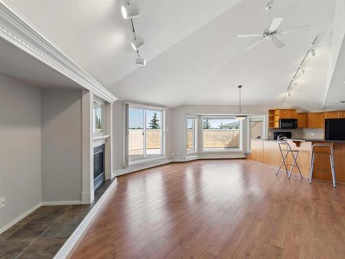 409 15499 Castle Downs Road, Edmonton, AB - Indoor Photo Showing Other Room With Fireplace