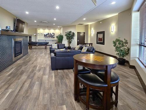 406 7909 71 Street, Edmonton, AB - Indoor Photo Showing Living Room With Fireplace