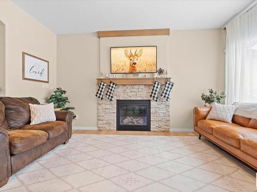 176 Henderson Link, Spruce Grove, AB - Indoor Photo Showing Living Room With Fireplace