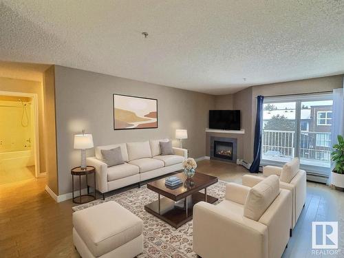 205 11446 40 Avenue, Edmonton, AB - Indoor Photo Showing Living Room With Fireplace