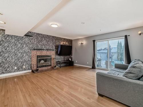 1817 Tomlinson Crescent Nw, Edmonton, AB - Indoor Photo Showing Living Room With Fireplace