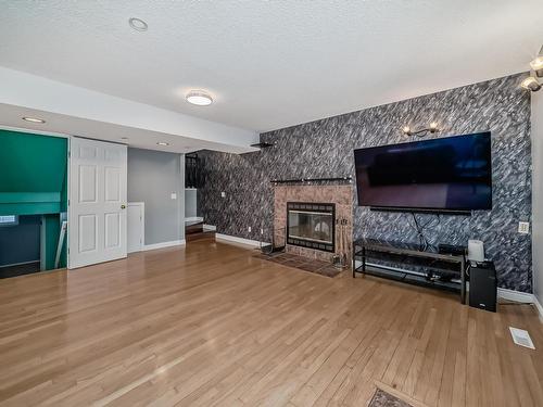 1817 Tomlinson Crescent Nw, Edmonton, AB - Indoor Photo Showing Living Room With Fireplace