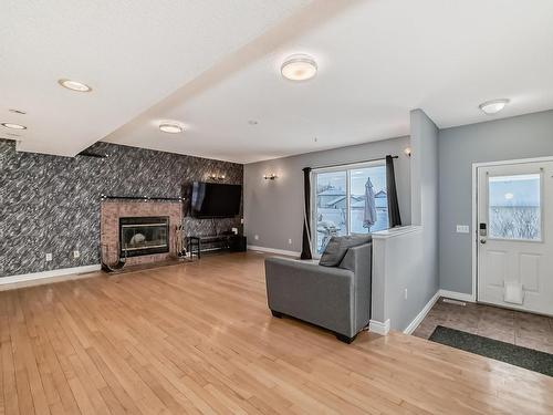 1817 Tomlinson Crescent Nw, Edmonton, AB - Indoor Photo Showing Living Room With Fireplace