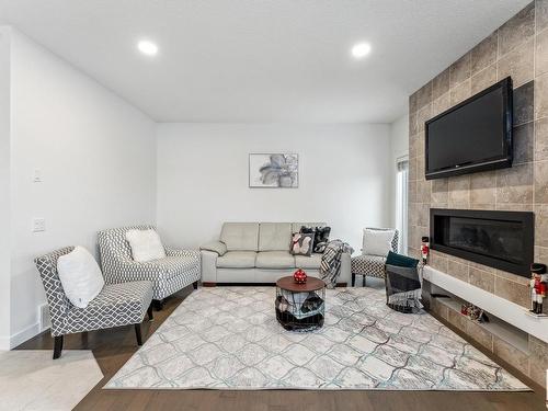 7844 Erasmus Wynd, Edmonton, AB - Indoor Photo Showing Living Room With Fireplace