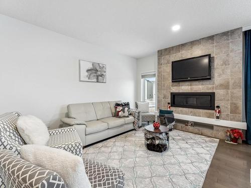 7844 Erasmus Wynd, Edmonton, AB - Indoor Photo Showing Living Room With Fireplace