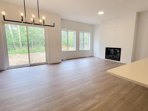 293 Rancher Road, Ardrossan, AB - Indoor Photo Showing Living Room With Fireplace