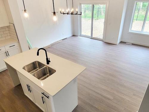 293 Rancher Road, Ardrossan, AB - Indoor Photo Showing Kitchen With Double Sink