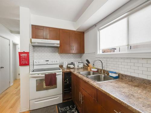 10632 51 Avenue, Edmonton, AB - Indoor Photo Showing Kitchen With Double Sink