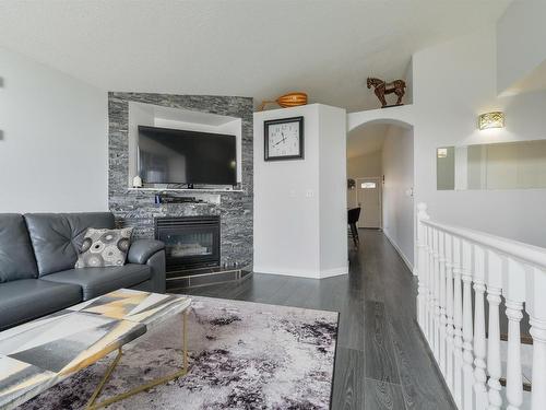 417 Hollick-Kenyon Road, Edmonton, AB - Indoor Photo Showing Living Room With Fireplace