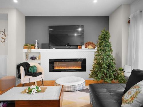 20 230 Edgemont Road, Edmonton, AB - Indoor Photo Showing Living Room With Fireplace