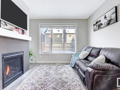 20722 99A Avenue, Edmonton, AB - Indoor Photo Showing Living Room With Fireplace