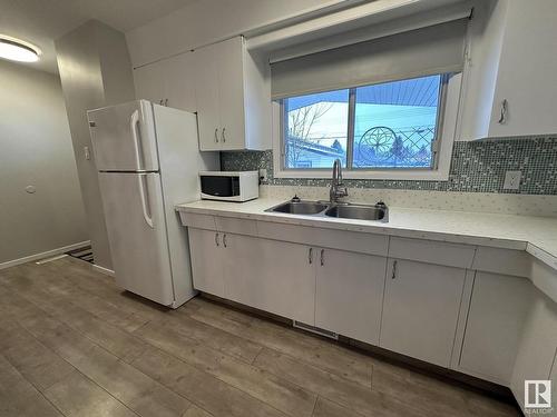 338 West Railway Drive, Smoky Lake Town, AB - Indoor Photo Showing Kitchen With Double Sink